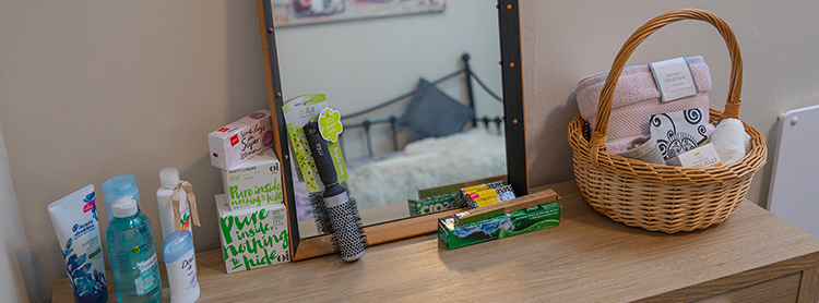 Toiletries arranged on dresser