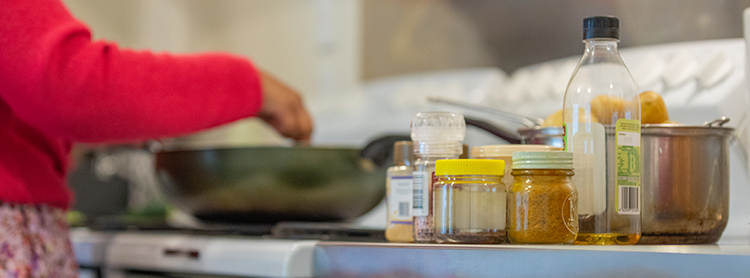 Woman cooking at stove